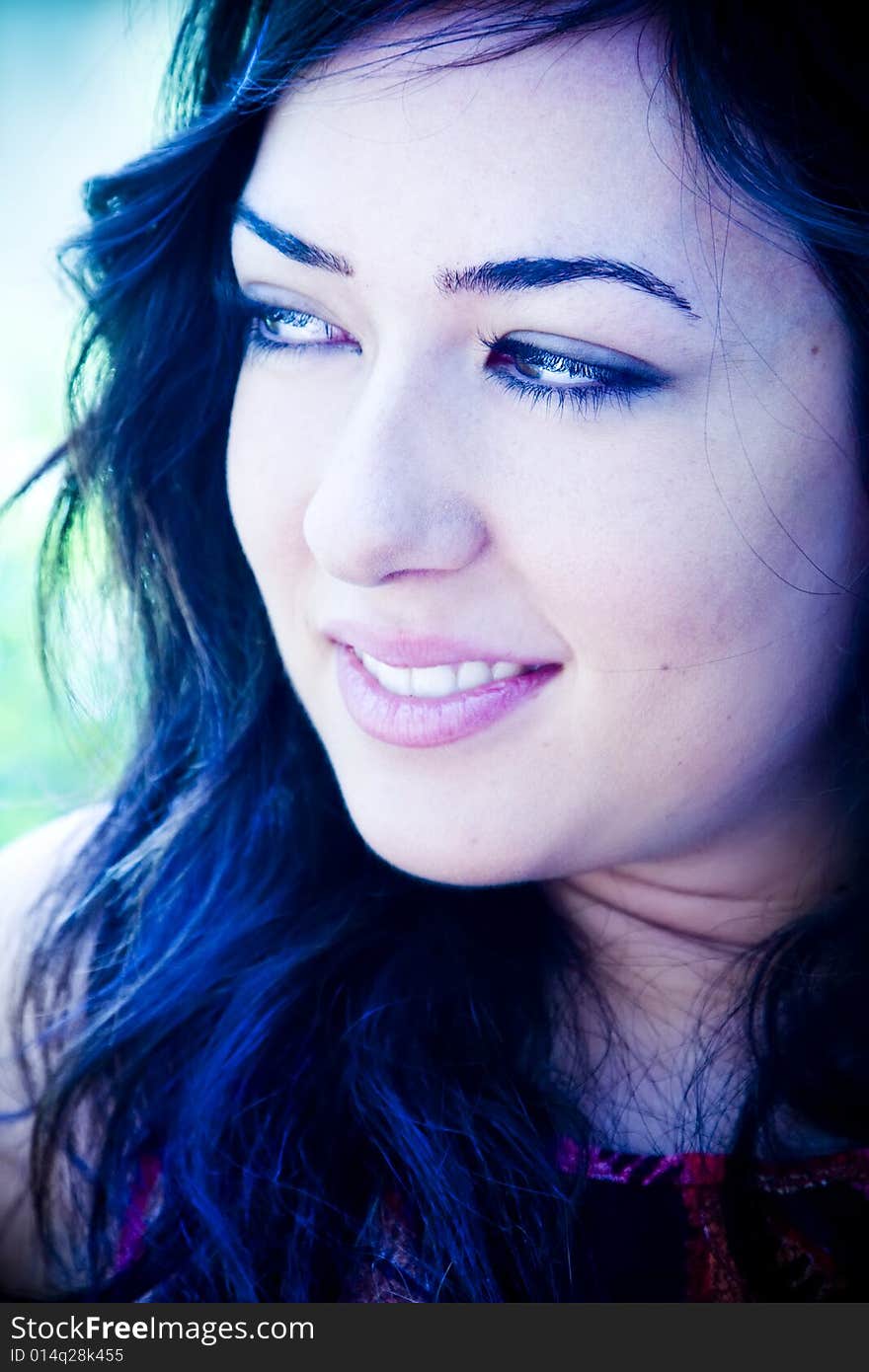 Smiling young woman portrait, ice tone. Smiling young woman portrait, ice tone.