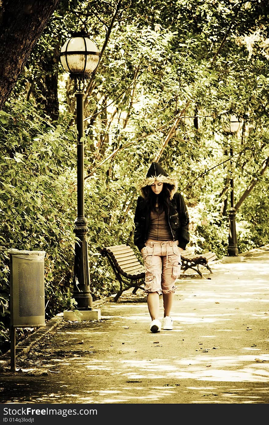 Young Woman Walking In The Park