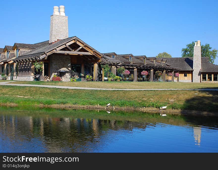 This is a shot of a local public park flower house. It is an outdoor shot and includes a partial reflection on the lake.