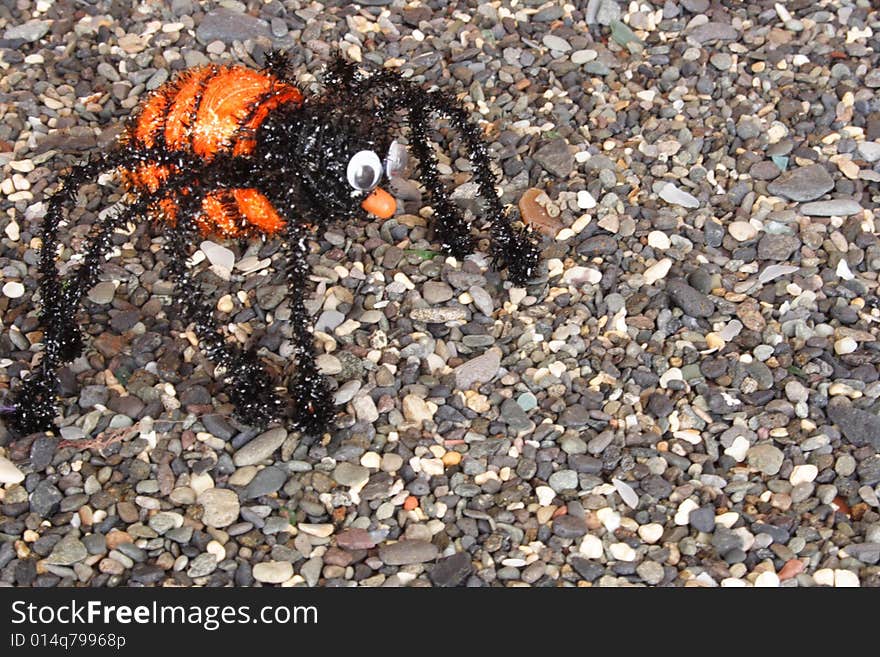 Orange tarantula on the floor in Halloween time. Orange tarantula on the floor in Halloween time