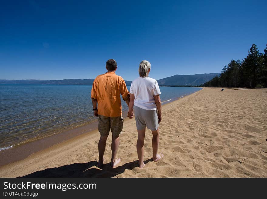 Senior couple having fun on sunny beach. Senior couple having fun on sunny beach