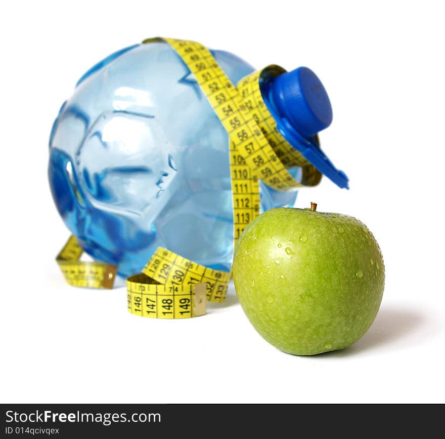 Plastic bottle of water and green apple. Plastic bottle of water and green apple