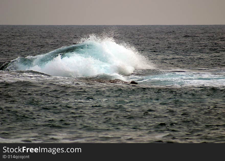 A wave in a bay in Majorca in Spain