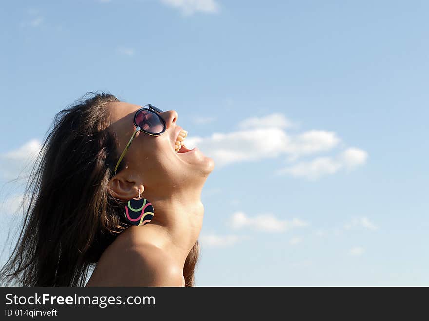 Portrait of the young beautiful girl on a background of sky. Portrait of the young beautiful girl on a background of sky