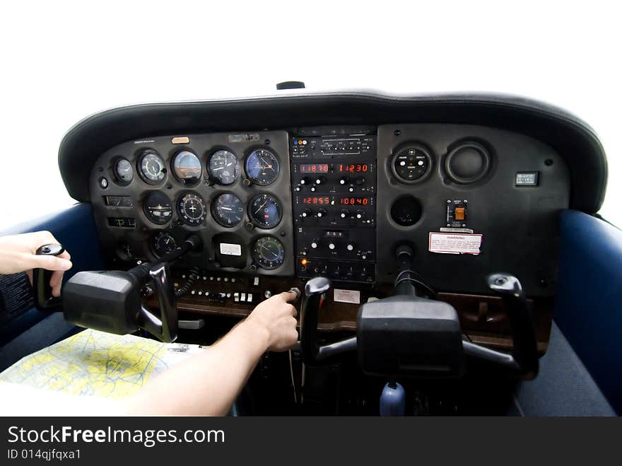 Inside of an airplane cockpit  on a bright day