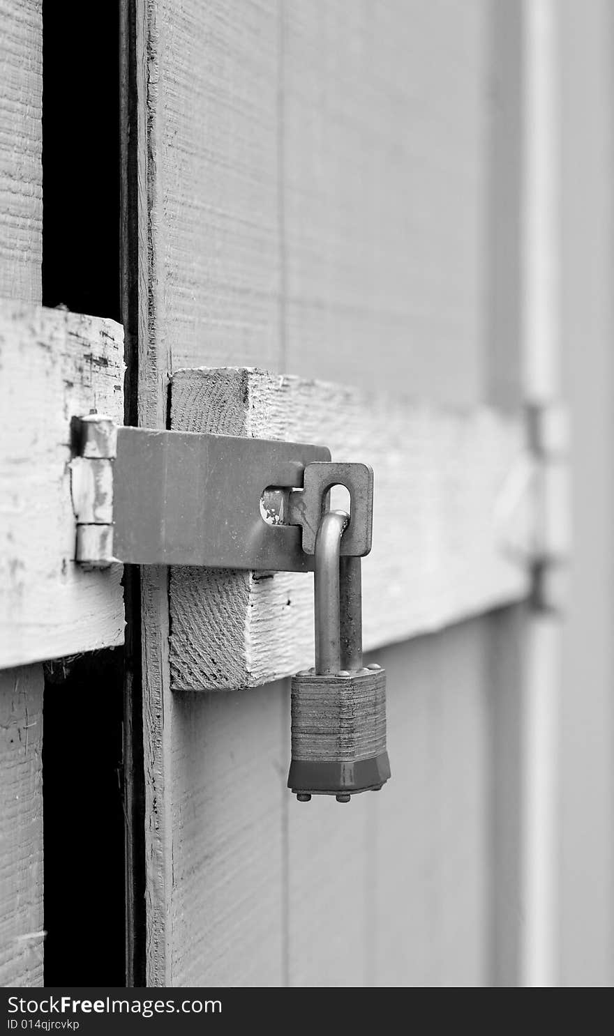 A Door Being Padlocked for Safety