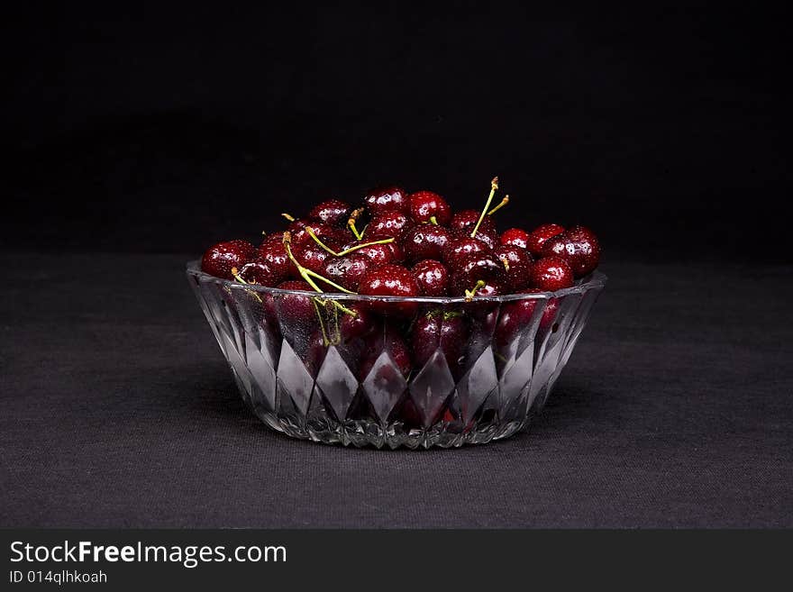 Shot of a freshly washed bowl of cherries in a crystal bowl.