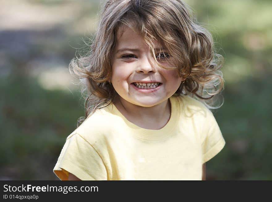 A picture of a cute little girl smiling. A picture of a cute little girl smiling