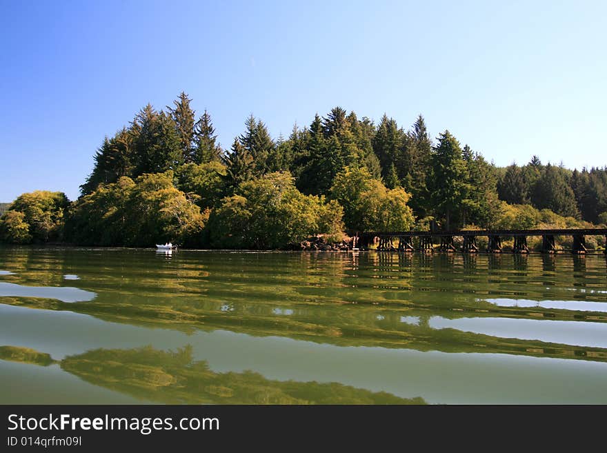 Lake on the Oregon Coast with great fishing and reflections between the small waves. Lake on the Oregon Coast with great fishing and reflections between the small waves.