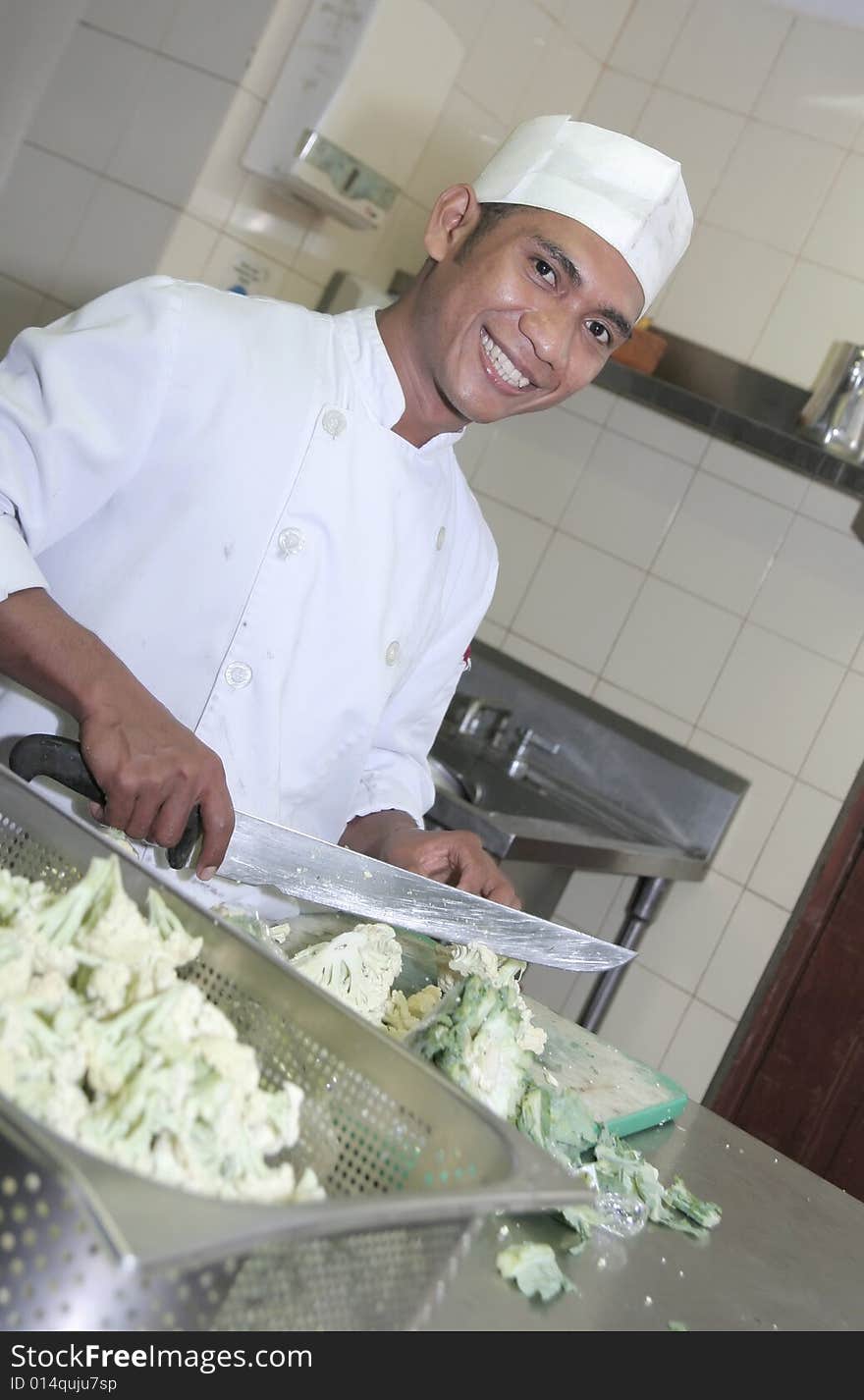 Chef at butcher, cutting vegetables