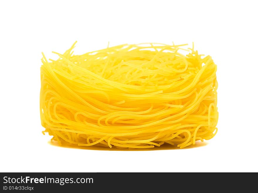 Yellow beautiful pasta on a white background