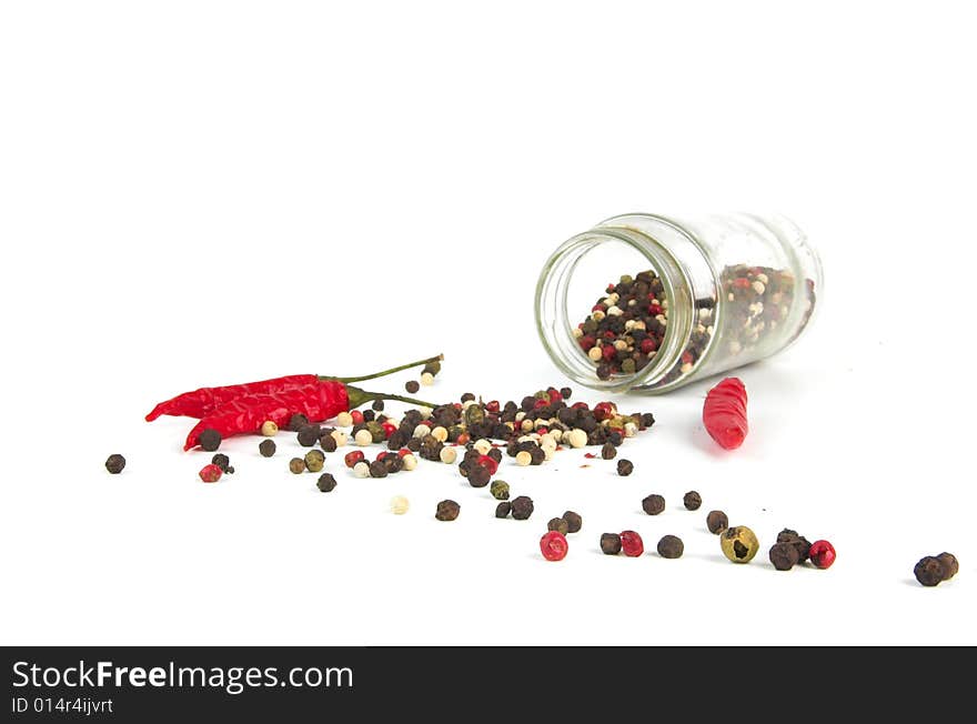 A row of spices on a white background