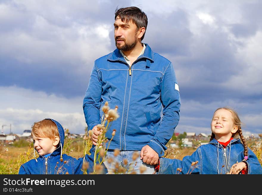 Father, son and daughter dressed in jeans