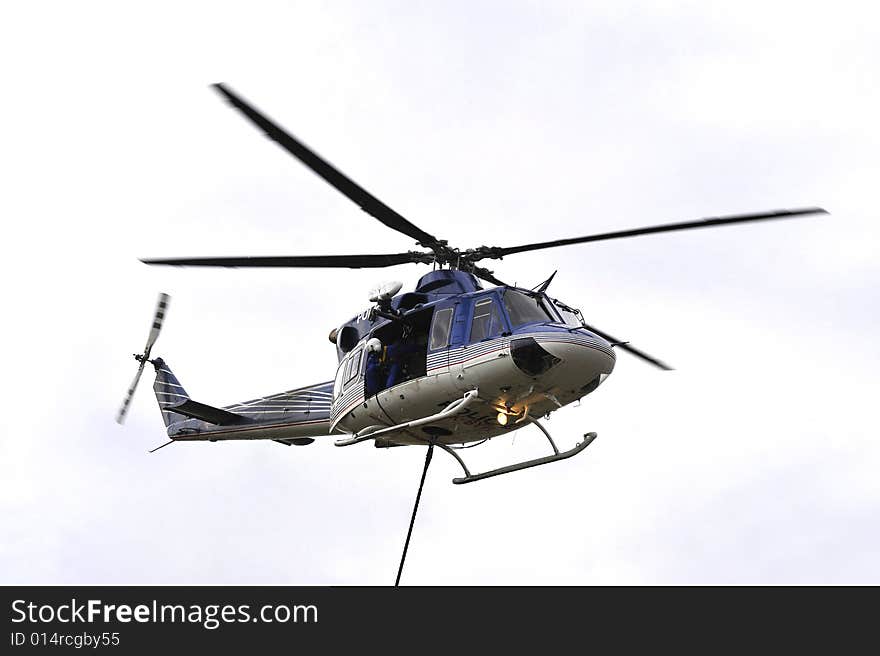 Detail of police descend from a helicopter. Detail of police descend from a helicopter