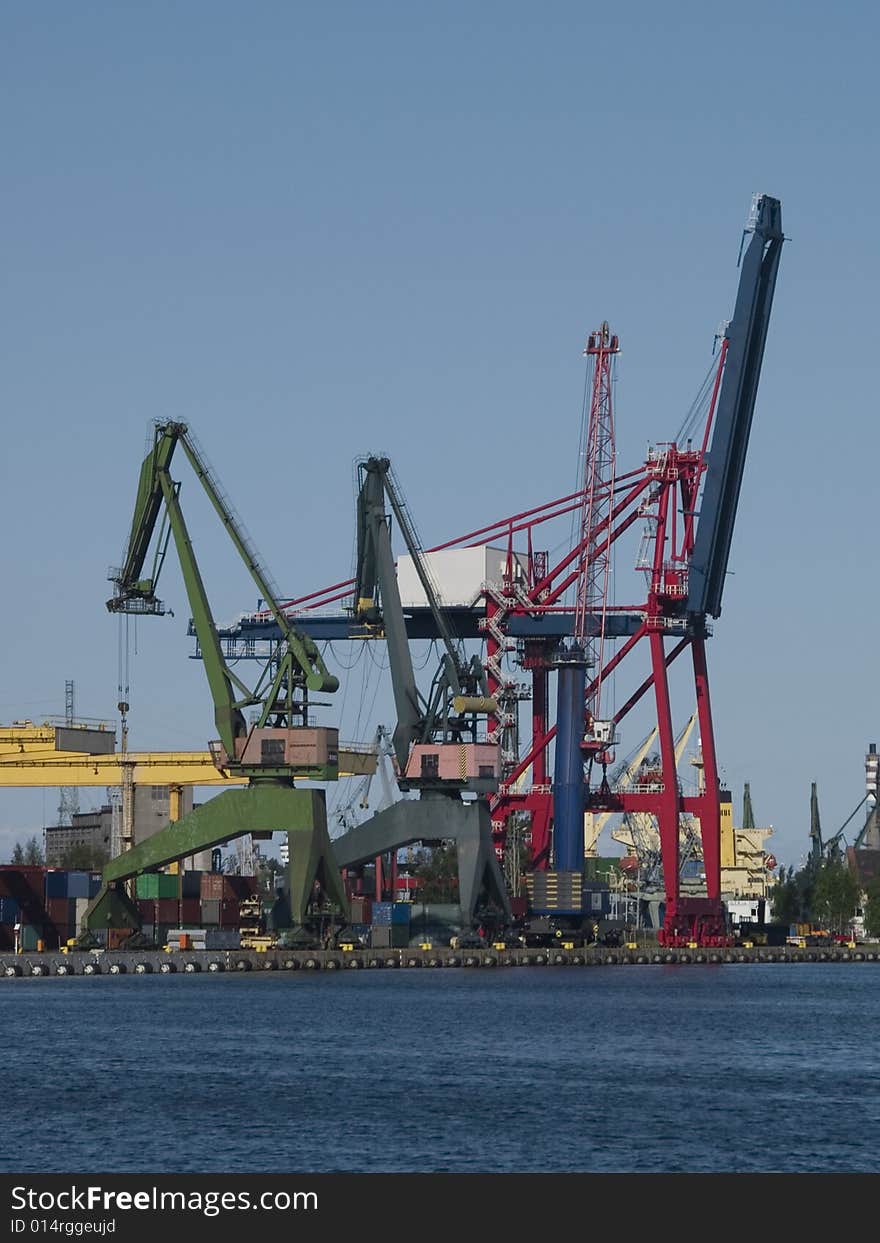 Gantry cranes and containers in a harbor. Gantry cranes and containers in a harbor