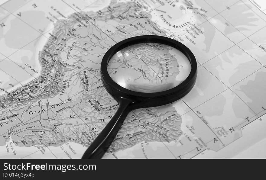 A magnifying glass on Europe map. A magnifying glass on Europe map