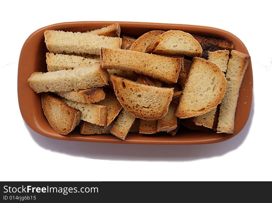 Crackers in brown bowl isolated on white