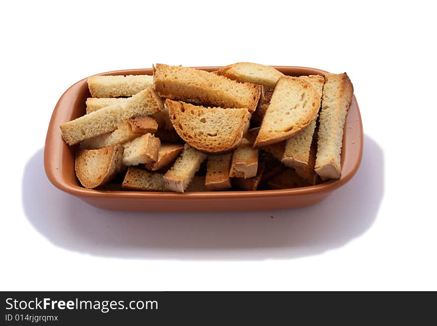 Crackers in brown bowl on wooden table