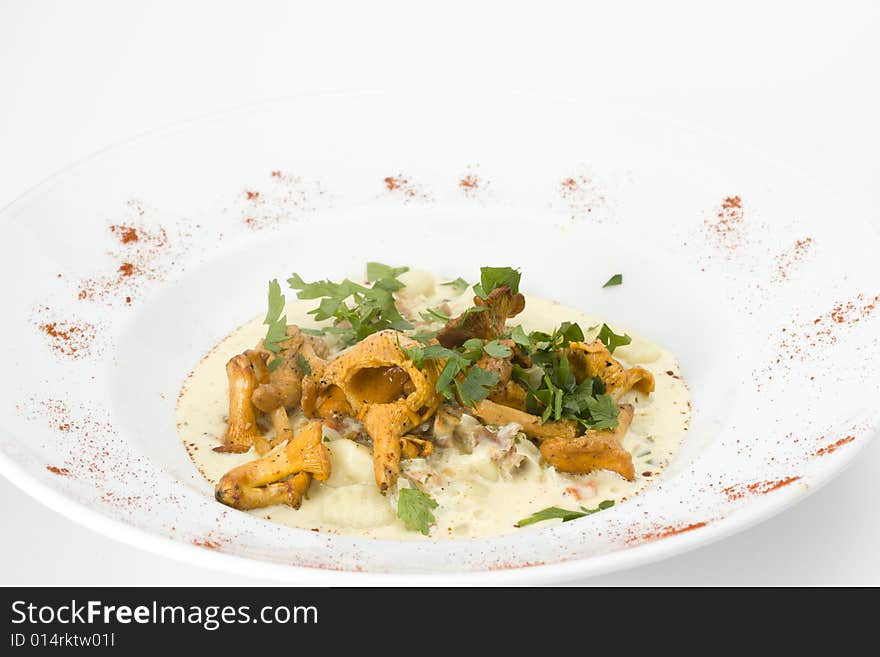 Chanterelles and gnocchi pasta on a plate