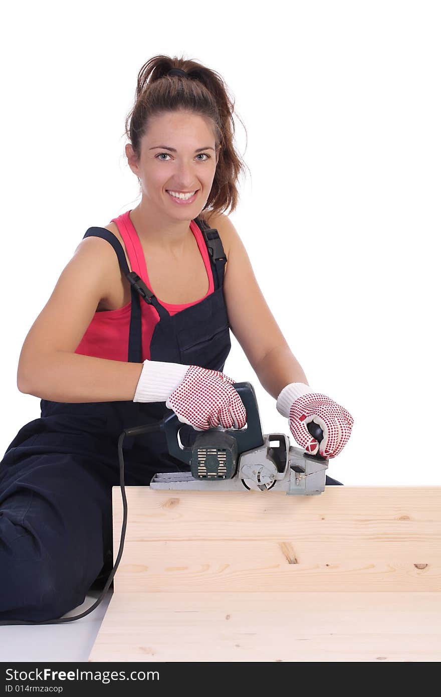 Woman carpenter at work on white background