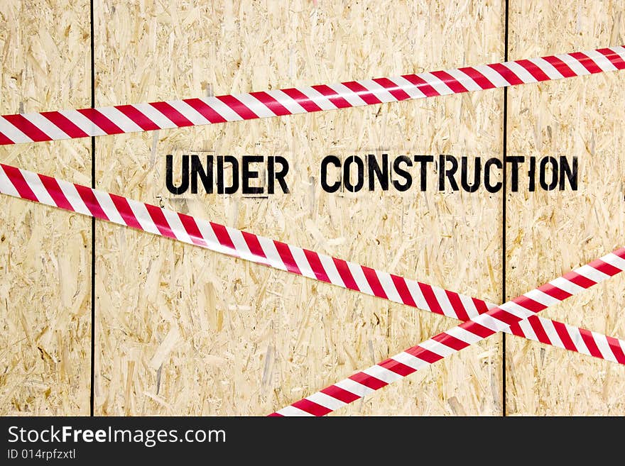 Construction warning on wood panels