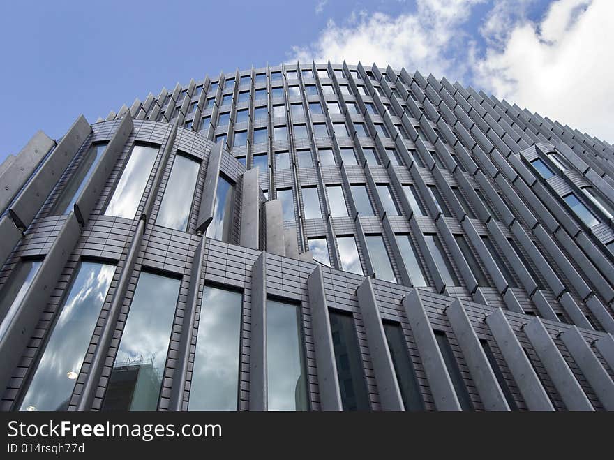 Modern glass building with sky reflections in the windows. Modern glass building with sky reflections in the windows