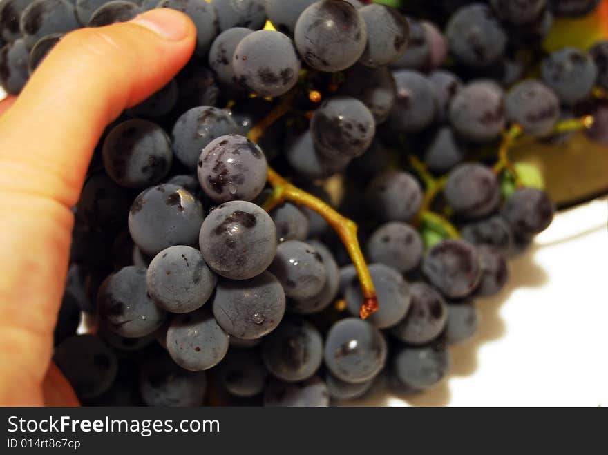 Black grapes and finger