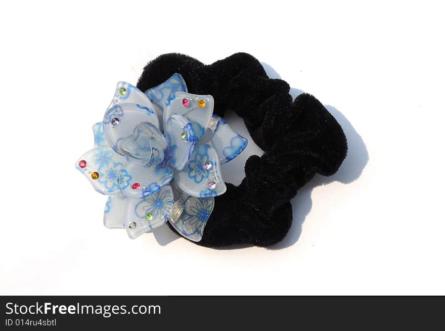 The black elastic hair bandeau with colorful plastic flower for women.