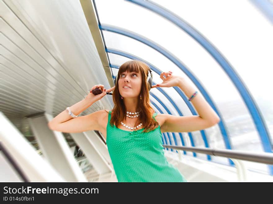 Girl listening to music and dancing