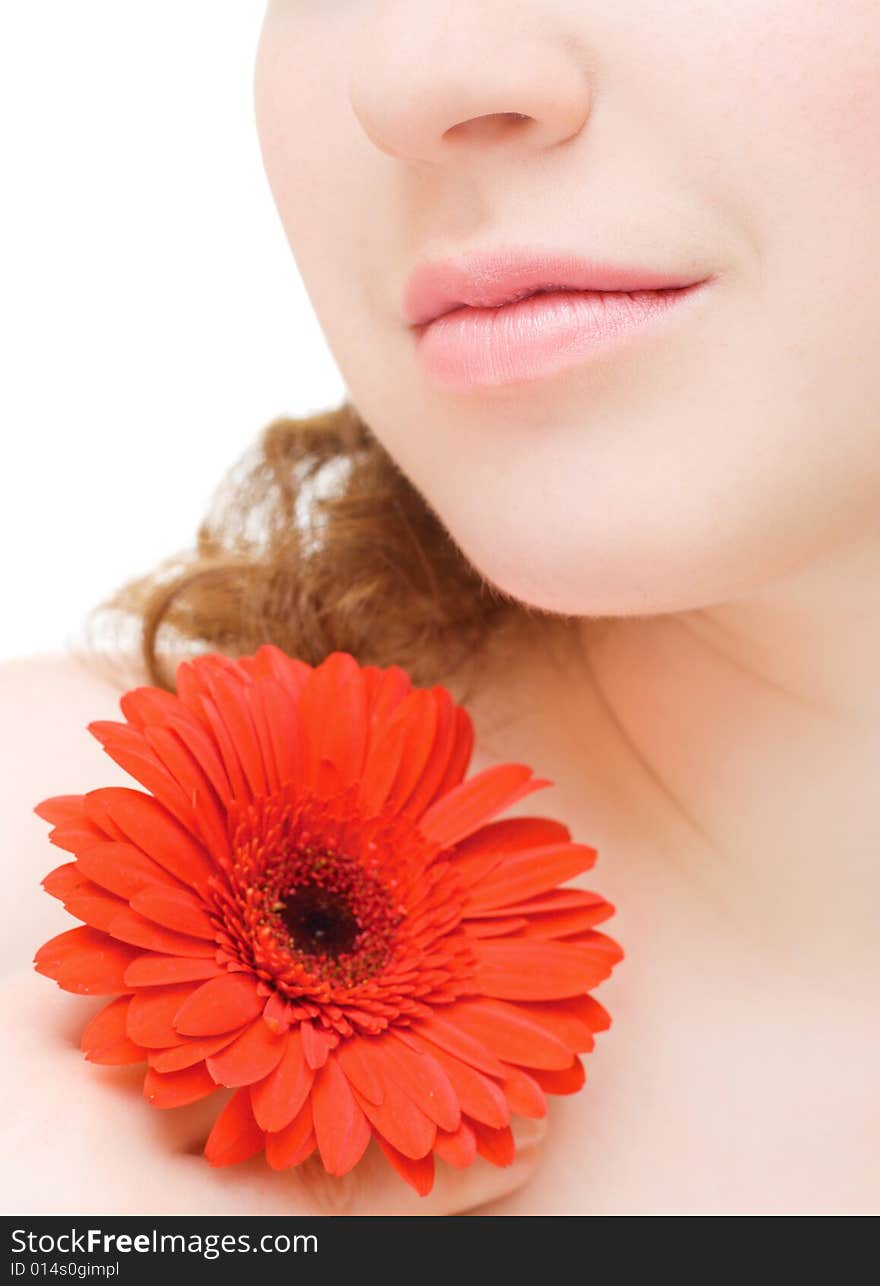 Young woman with a red flower