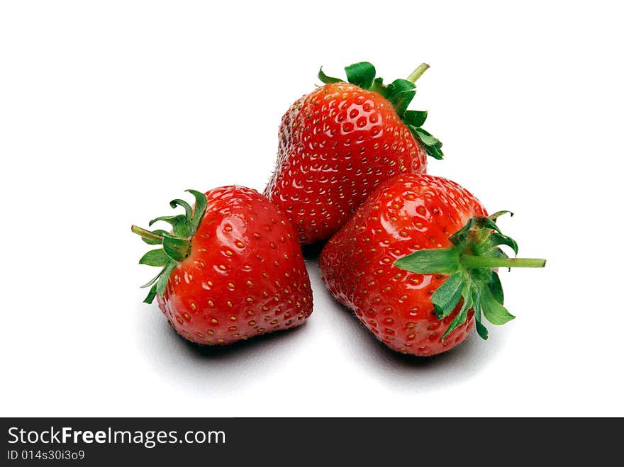 Three strawberries on a white background