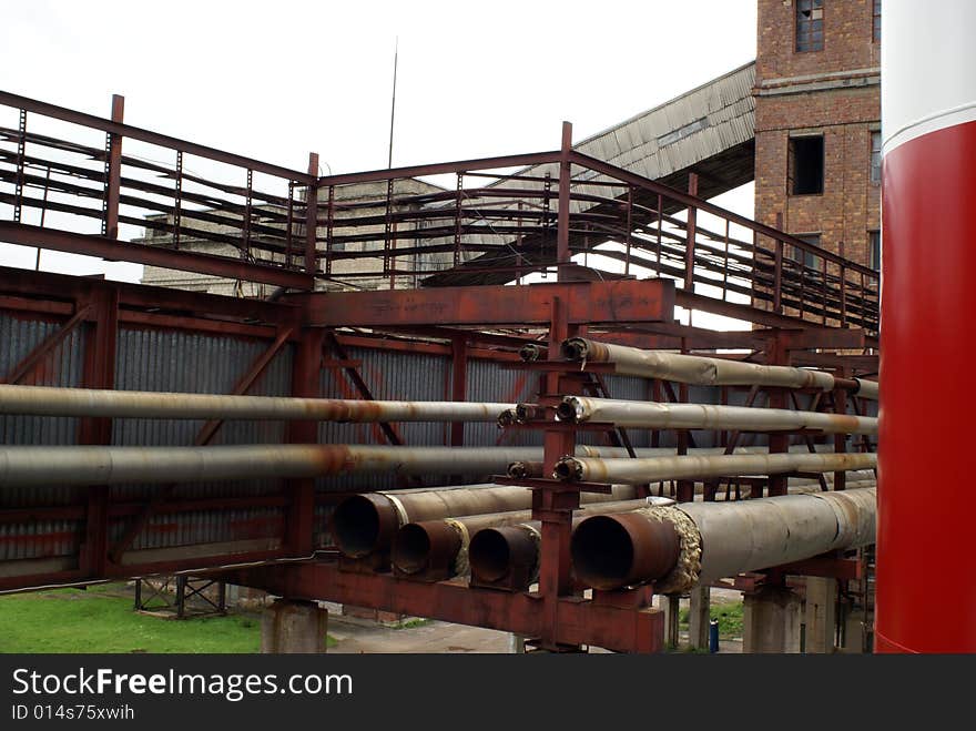 Old pipelines at abandoned factory. Old pipelines at abandoned factory