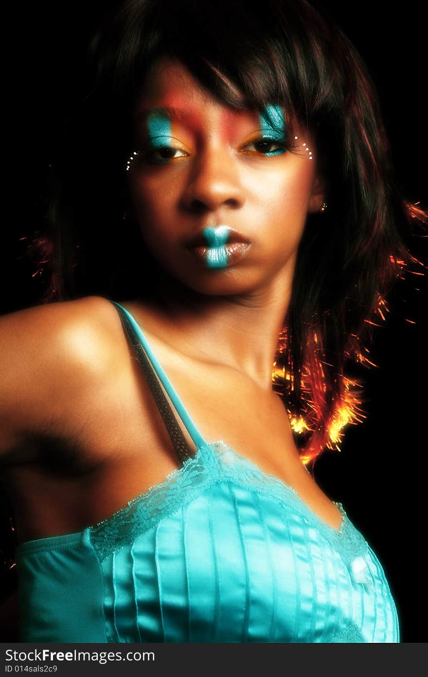 Beautiful African American woman in artistic cosmetics. Beautiful African American woman in artistic cosmetics.