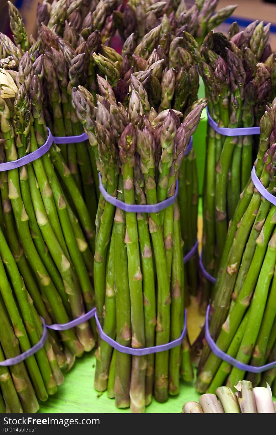 Bunches of asparagus at a local farmers' market. Bunches of asparagus at a local farmers' market.