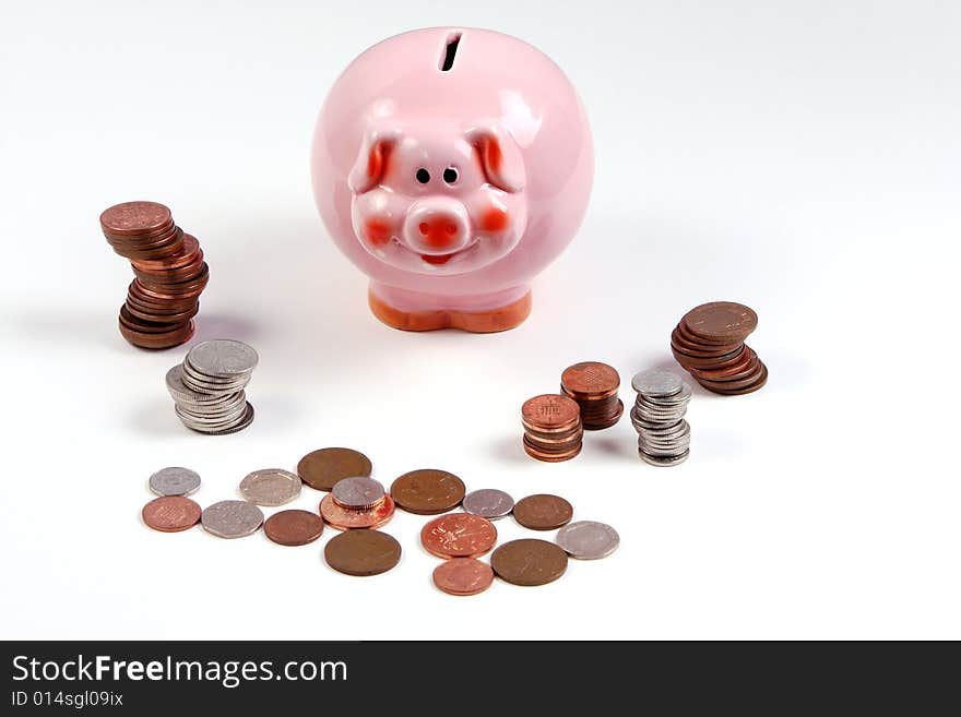 Pink piggy bank with piles of cash. Pink piggy bank with piles of cash