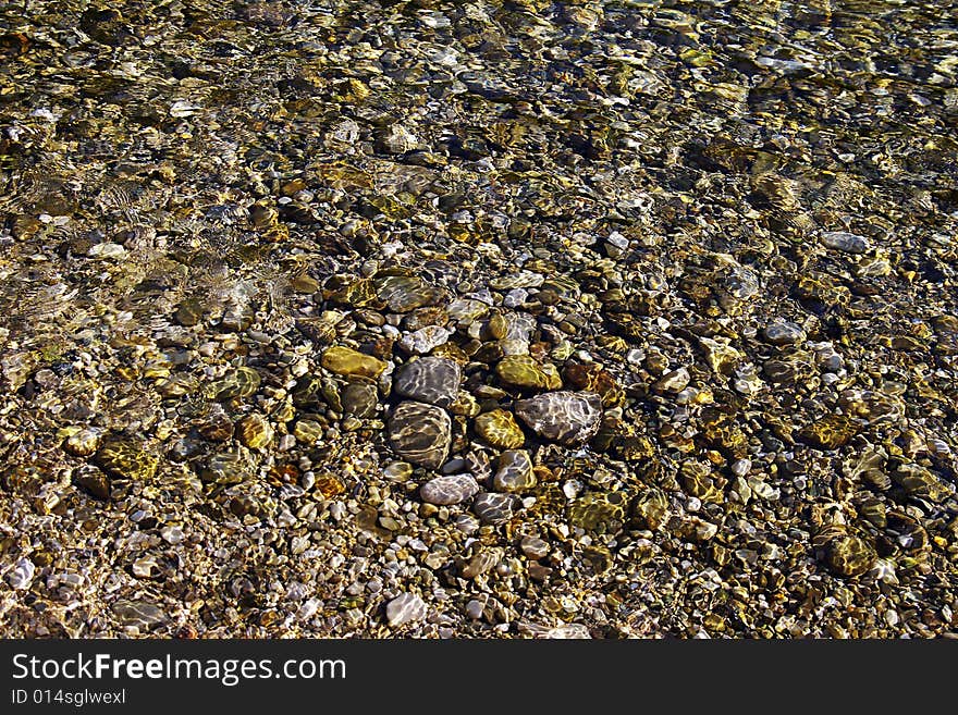 On a photo fragment of a surface of crystal-clear sea water