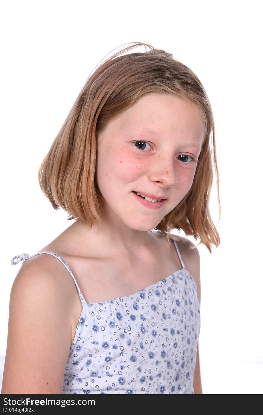 Freckled little girl with small smile