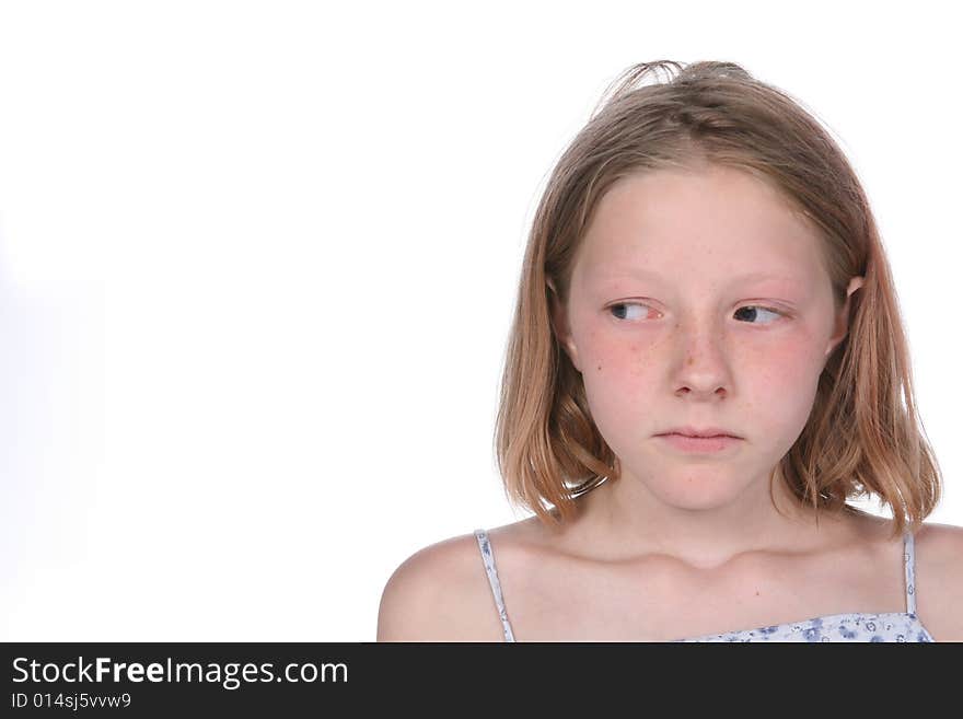 Girl with freckles looking off to the side at the copy space or text space