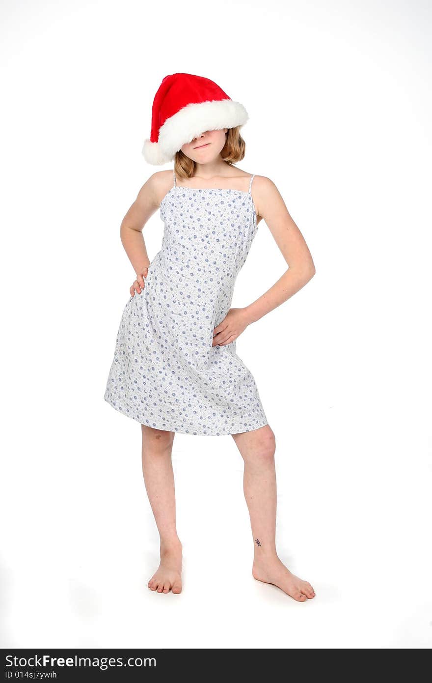 Young girl in dress with a santa hat over her face