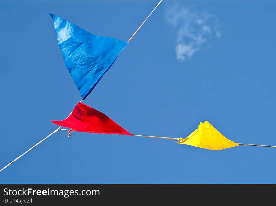 Colourful signal flags hanging on a wire