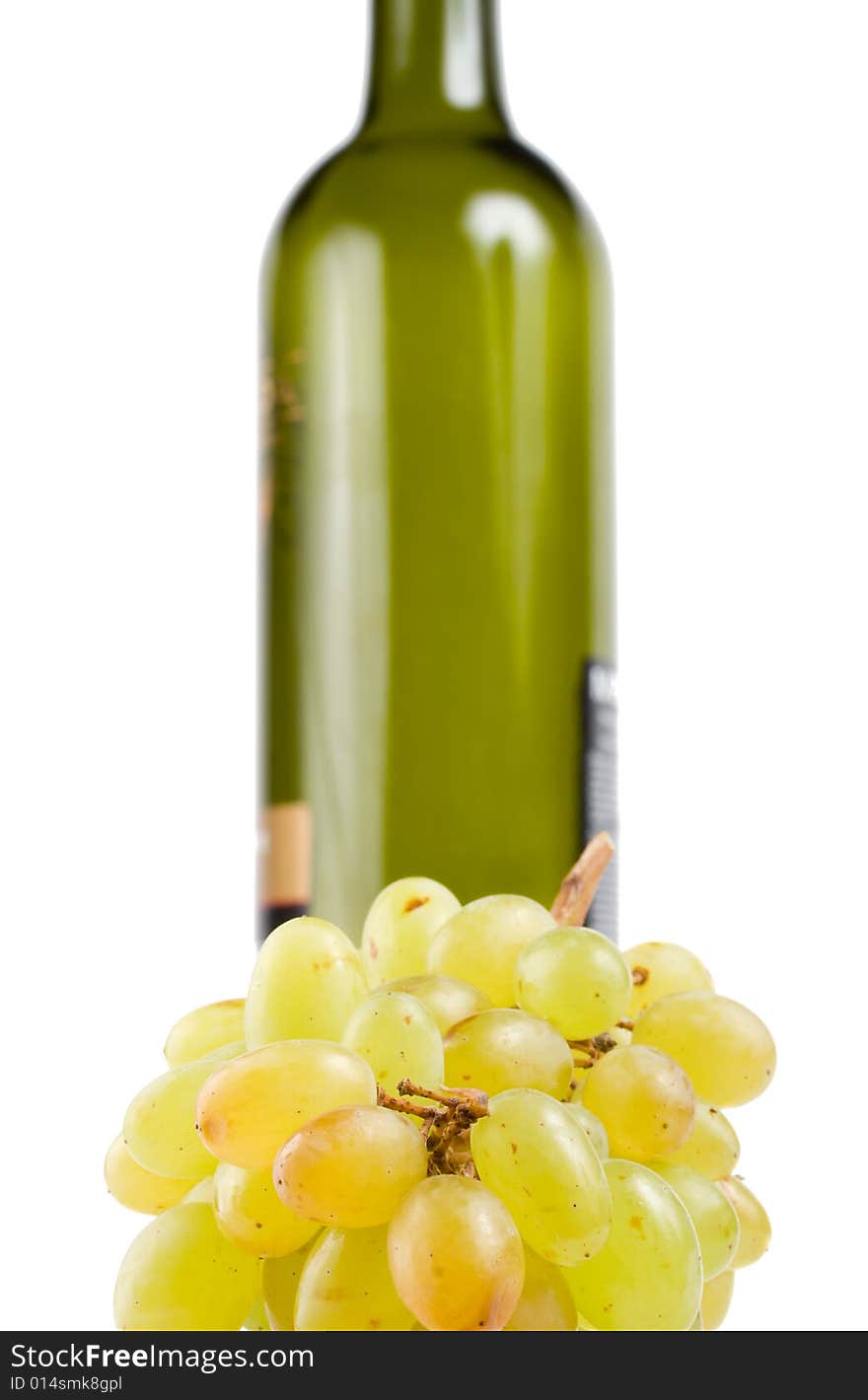 Bottle and green grapes