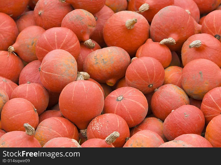 Lots of pumpkins piled up