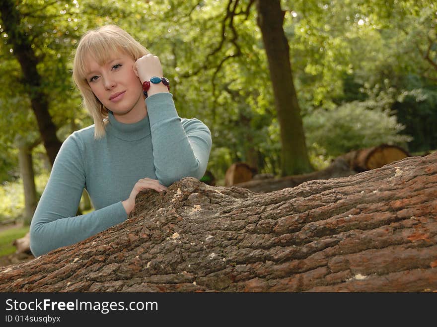 Attractive blond girl in woods