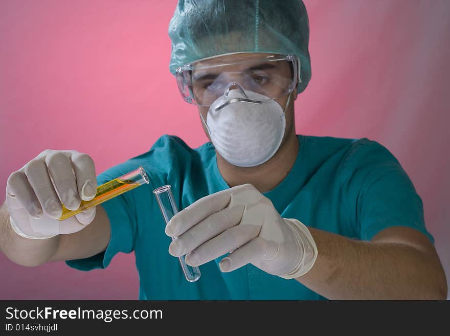 Young scientist working in a laboratory with mask. Young scientist working in a laboratory with mask