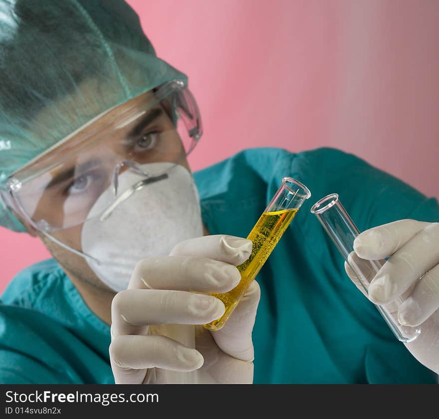 Young scientist working in a laboratory with mask. Young scientist working in a laboratory with mask