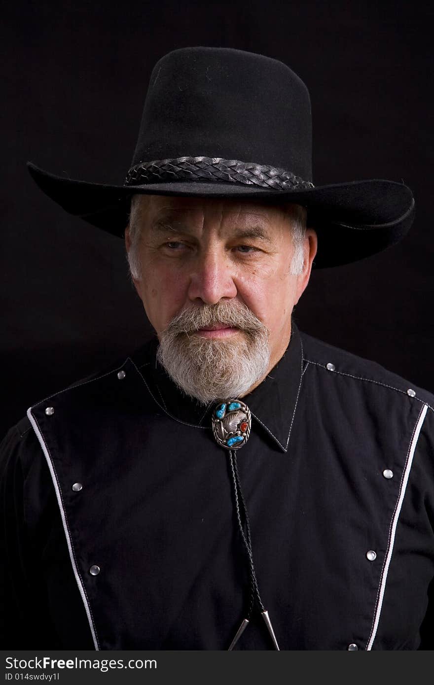 Shot of an older western man with a string tie.