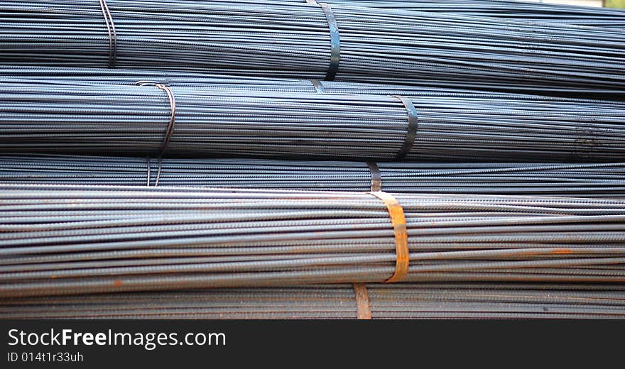 A tied bundle of cold steel bars on construction site