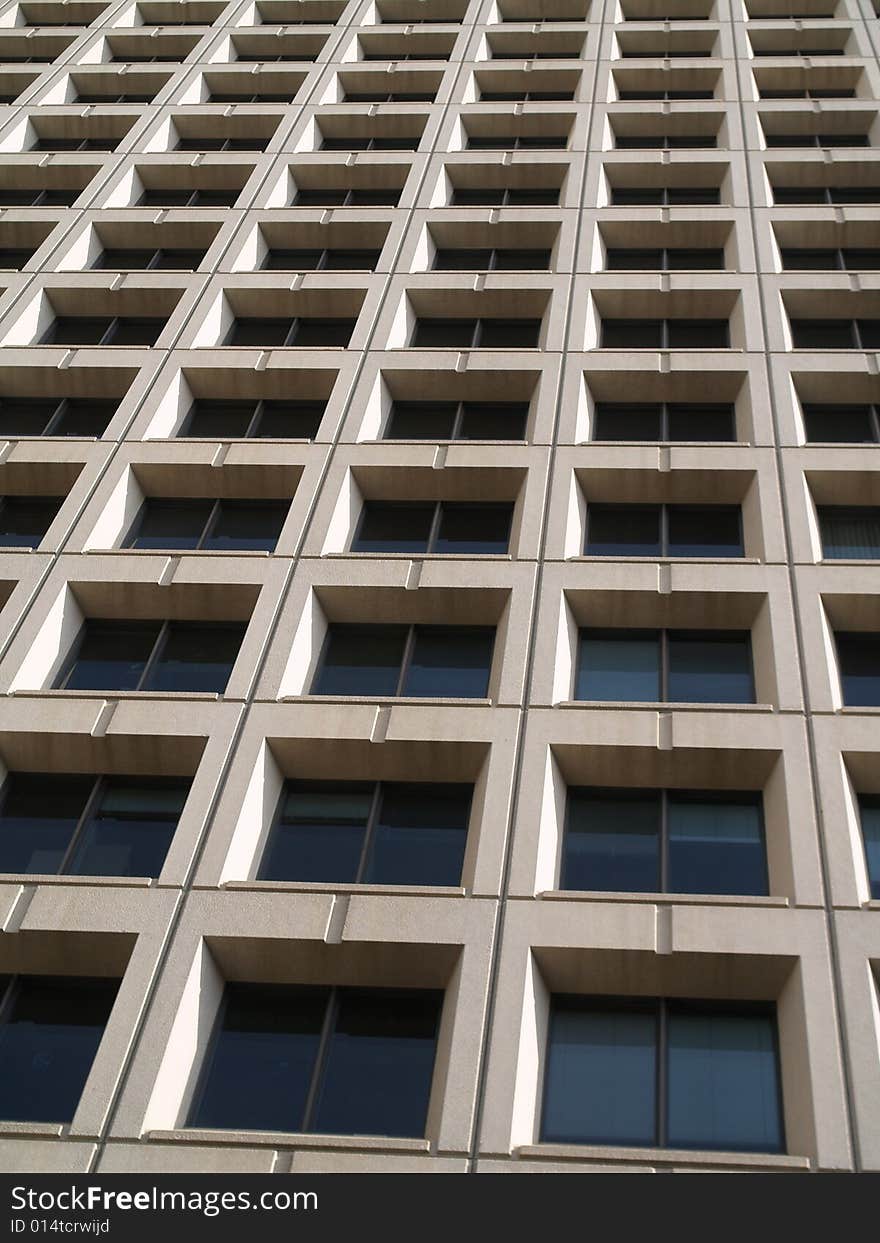 Upward view of skyscraper many windows. Upward view of skyscraper many windows