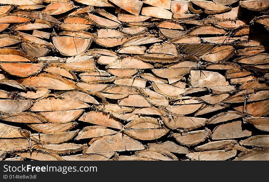 Wood logs wall showing its detailed texture. Wood logs wall showing its detailed texture