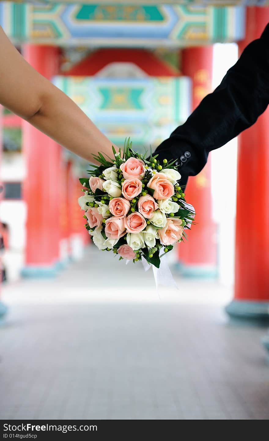 An image of a couple holding hands. An image of a couple holding hands